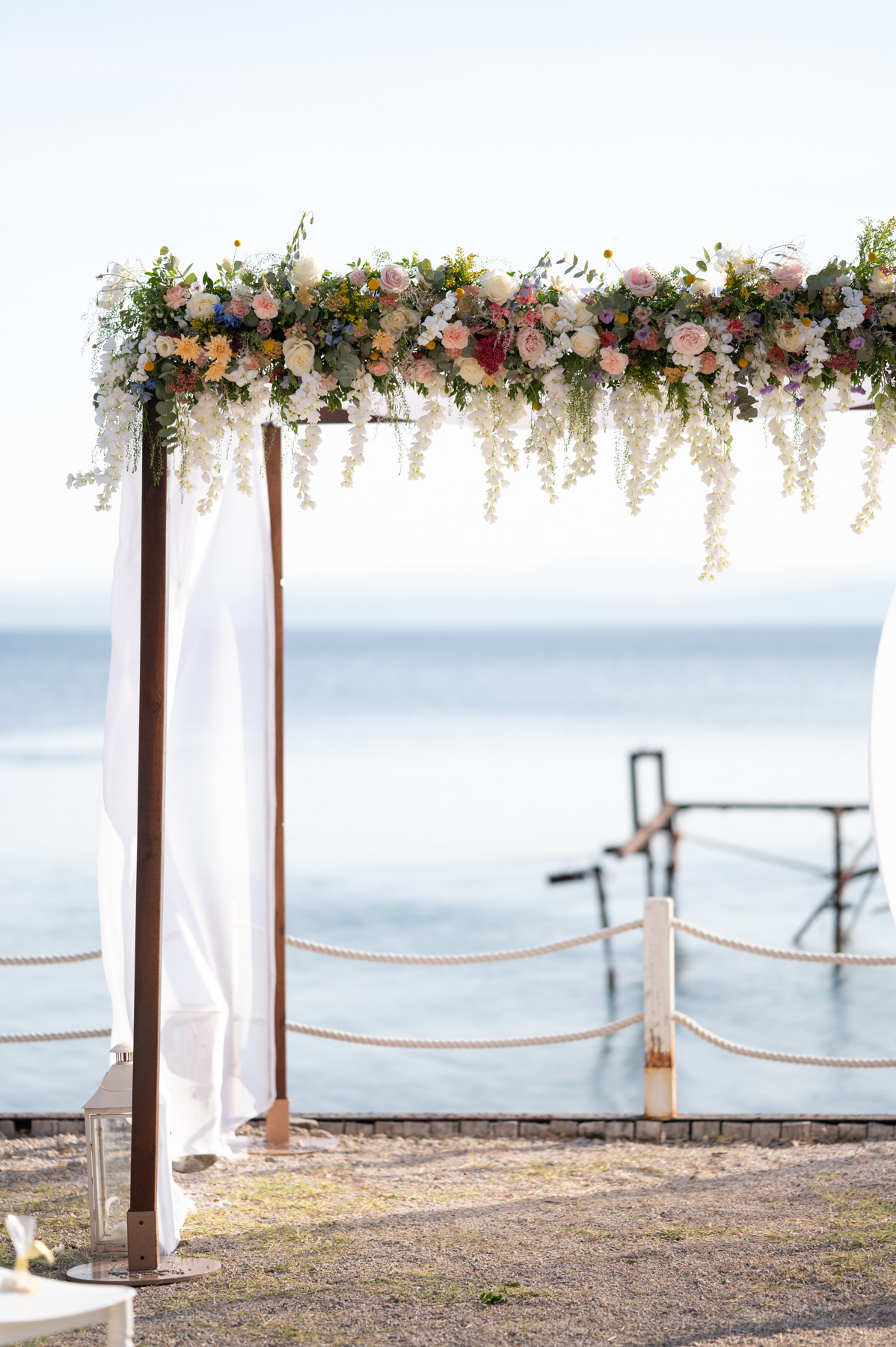 sirtaki events | wedding in greece | Canopy with the perfect flower arrangement